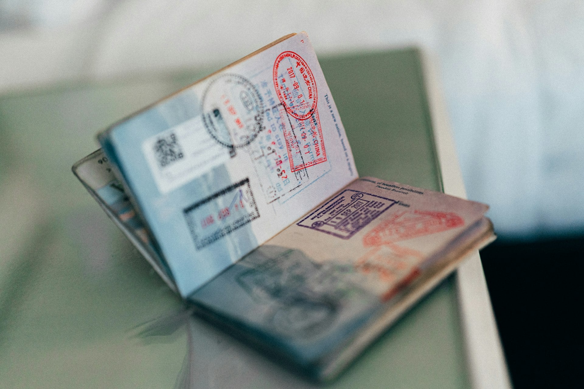 Open passport with visa stamps