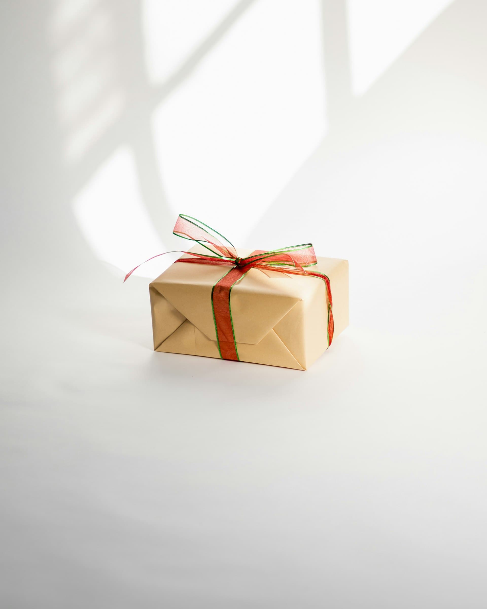 An elegantly wrapped gift box tied with ribbon